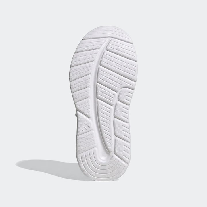 Underside view of a white Adidas Tensaur Run 4.0 children's shoe sole, featuring a distinct ribbed traction pattern.