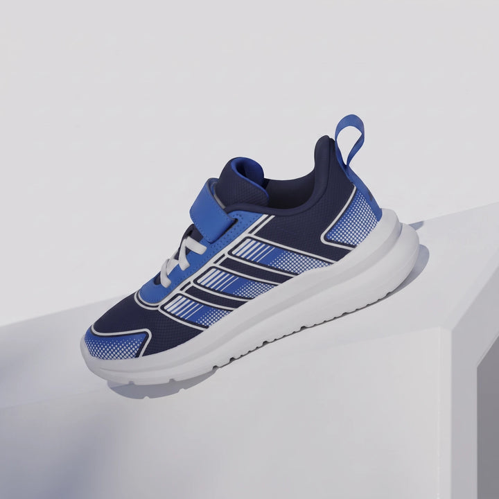 Navy blue and bright blue Tensaur Run 4.0 Children's Shoes with white stripes, sole, and velcro strap, displayed on a clean