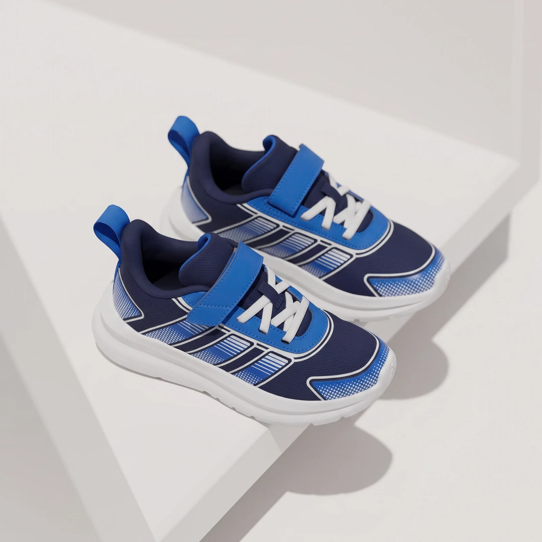 Two blue and white Tensaur Run 4.0 Children's Shoes with hook-and-loop closures and white soles.