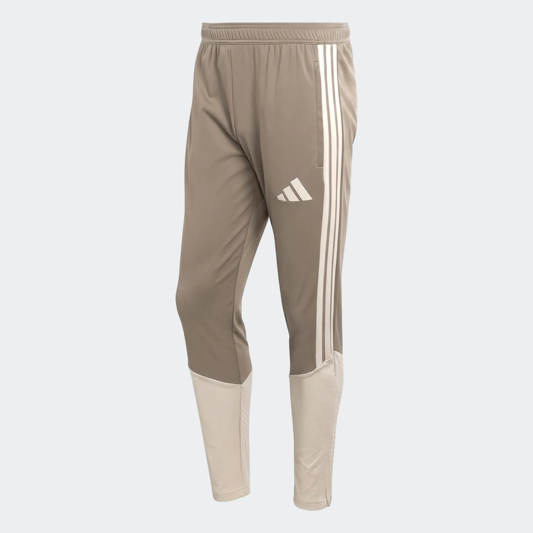 Tior26C men's brown and beige Adidas athletic pants, featuring three white stripes and an elastic waistband.