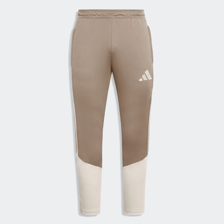 Tior26C Pant brown athletic pants with off-white panels and a white logo, designed for comfort and performance.