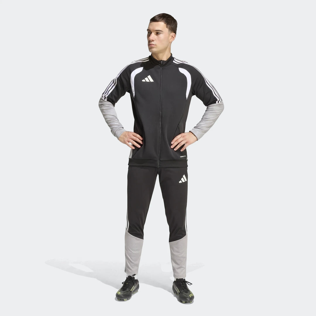 Male model in a full-body shot wearing a black and grey Adidas Tiro 26 Competition Training Jacket and matching tracksuit