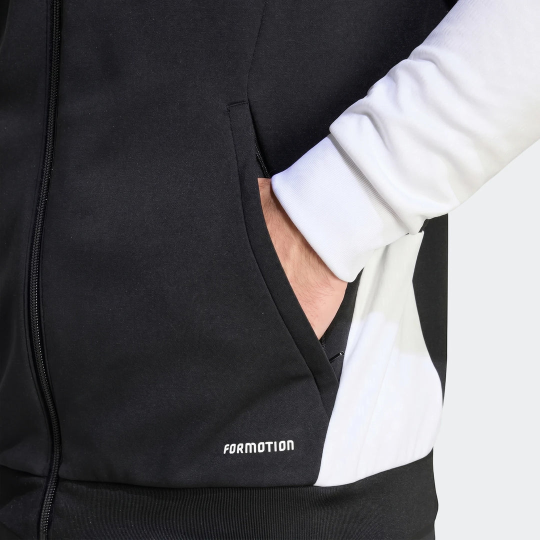 Close-up of a black and white Tiro 26 Competition Training Jacket on a person, showing the 'FORMOTION' logo and hand in