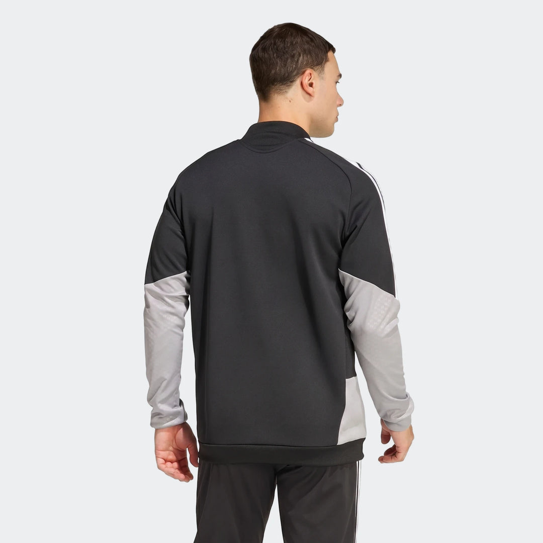 Male model wearing a black and gray Tiro 26 Competition Training Jacket, shown from the back view.
