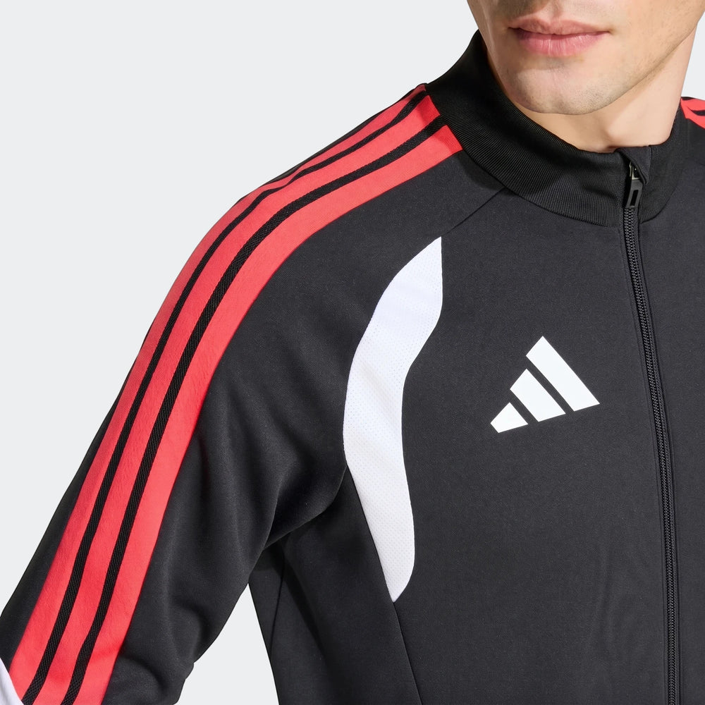 Close-up of a male model wearing a black Adidas Tiro 26 Competition Training Jacket with red shoulder stripes.