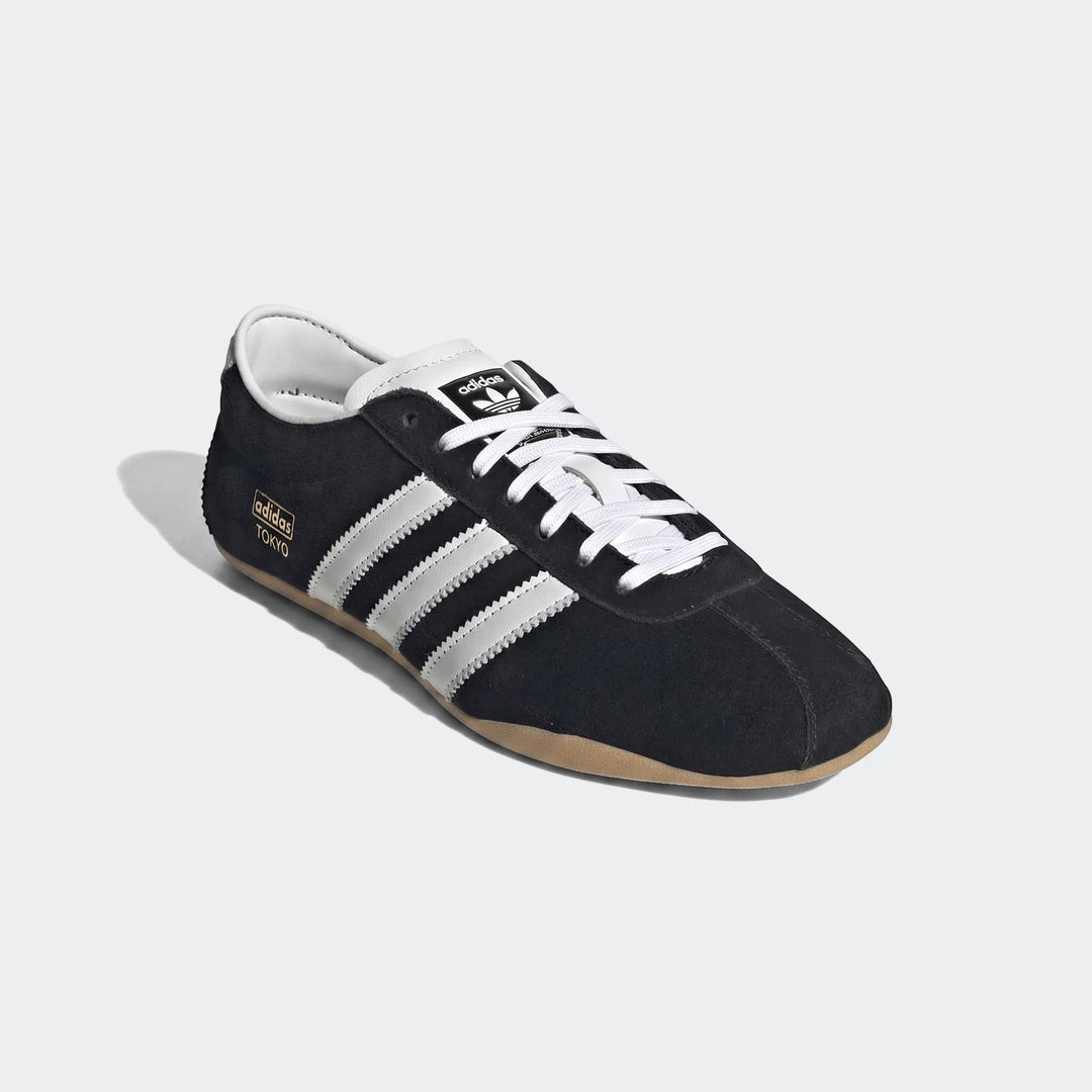 Tokyo Shoes in black suede with white Adidas three-striped accents and lace-up front.