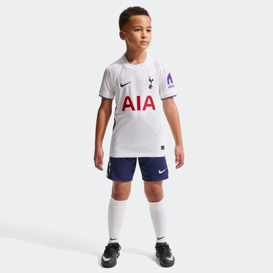 Young boy wearing Tottenham Hotspur 2026/27 Stadium Home Big Kids' Nike Dri-Fit Soccer Replica Jersey kit in white and navy