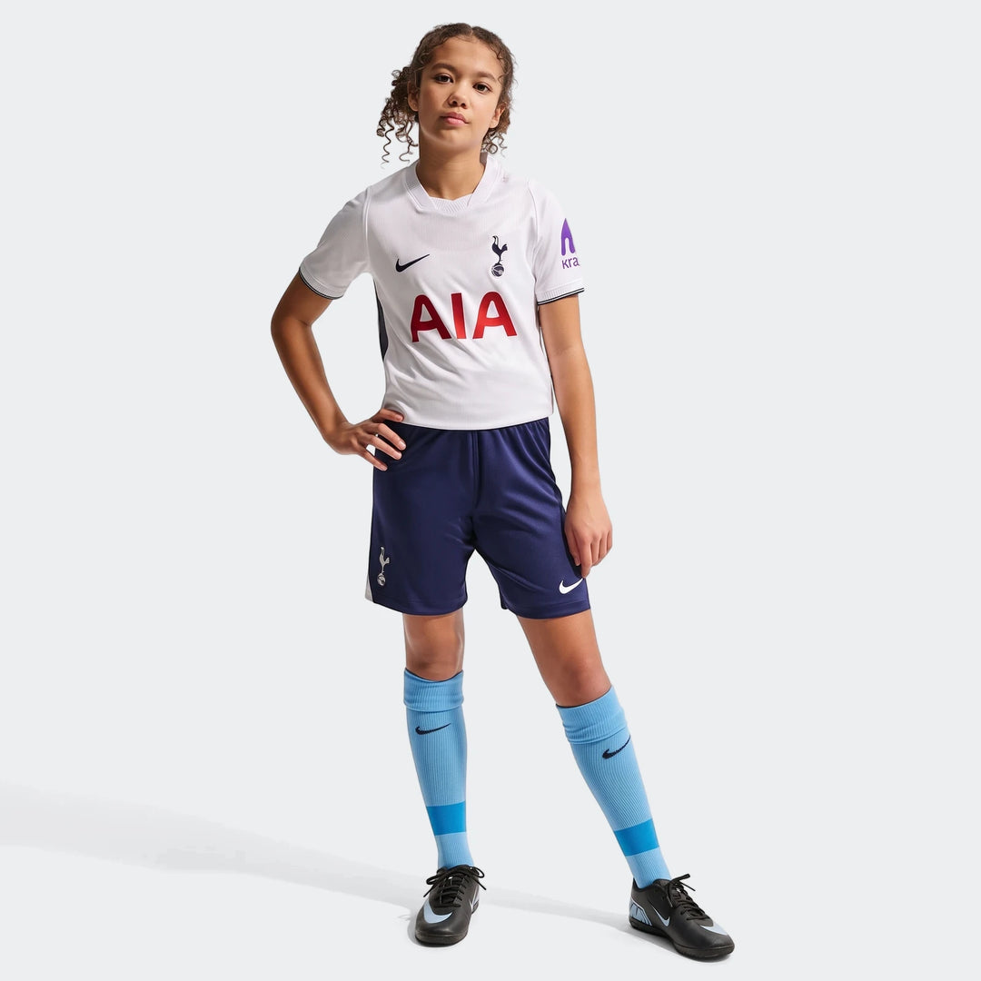 Young girl wears a Tottenham Hotspur 2026/27 Stadium Home Big Kids' Nike Dri-Fit Soccer Replica Jersey, white with navy
