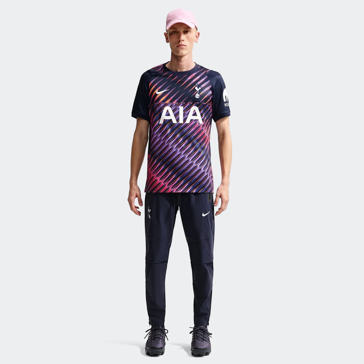 Male model wears dark blue, multi-striped Tottenham Hotspur 2026/27 Stadium Away Nike Dri-Fit Soccer Replica Jersey.