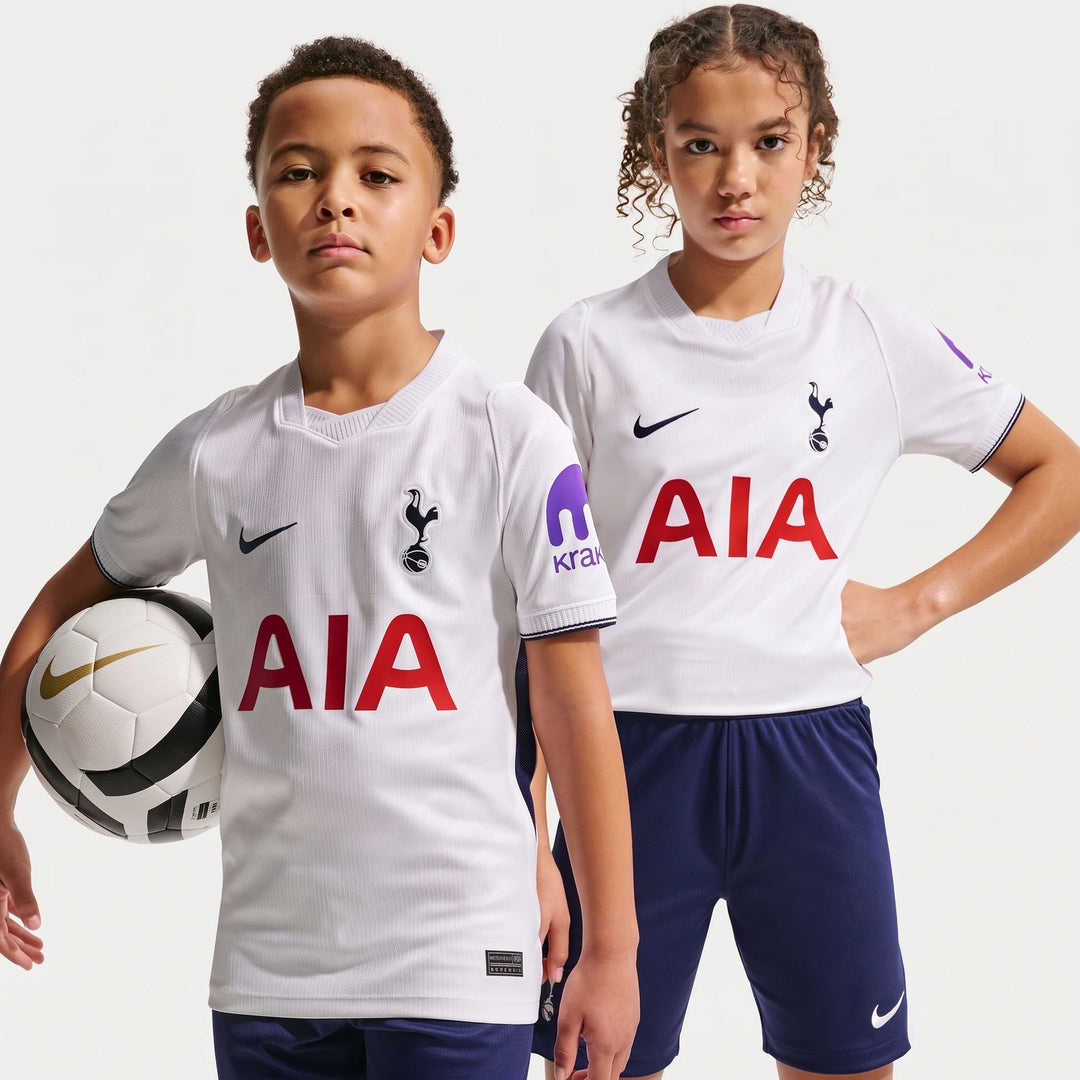 Two kids modeling the white Tottenham Hotspur 2026/27 Stadium Home Nike Dri-Fit Soccer Replica Jersey, with one holding a