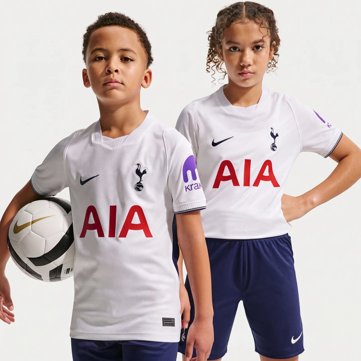 Two kids modeling the white Tottenham Hotspur 2026/27 Stadium Home Nike Dri-Fit Soccer Replica Jersey, with one holding a