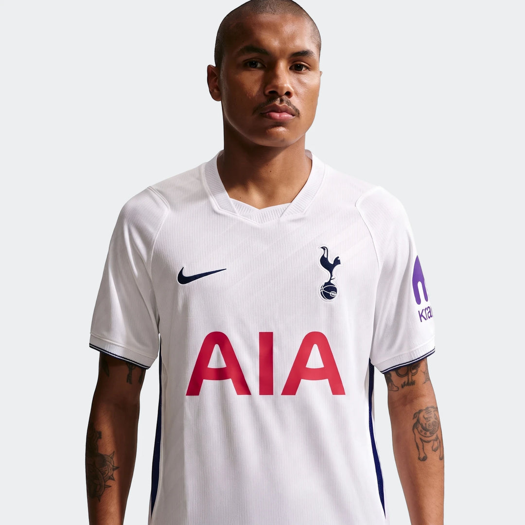 Male model wearing a white Nike Tottenham Hotspur 2026/27 Stadium Home Dri-Fit soccer replica jersey, front view.
