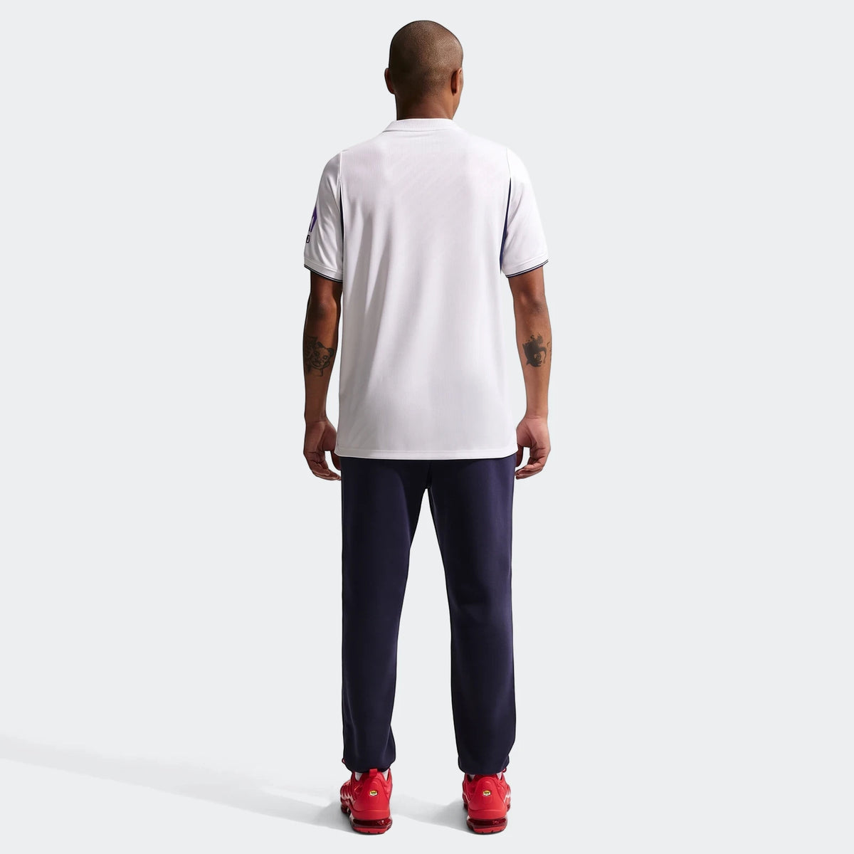 Rear view of a male model in a white Tottenham Hotspur 2026/27 Stadium Home Men's Nike Dri-Fit Soccer Replica Jersey.