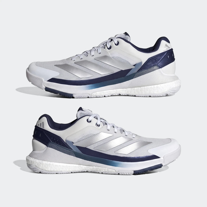 Two white and navy Adidas Crazyquick Boost Padel Shoes, featuring Boost midsole and mesh upper, shown from a side view.