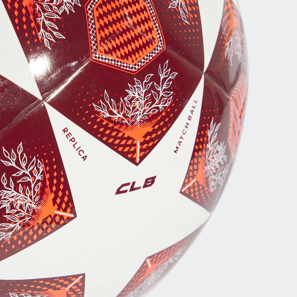 Ucl Club Size 3 soccer ball in white and red with intricate patterns, featuring 'REPLICA' and 'MATCH BALL' text, in a
