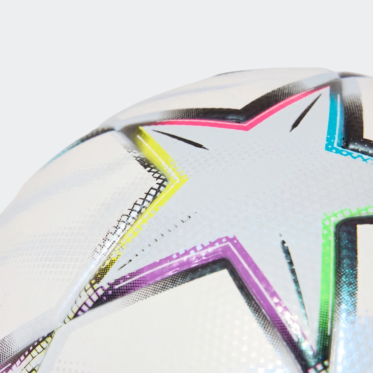 Close-up of a white Uefa Champions League 26/27 League Ball featuring vibrant pink, yellow, purple, and blue star-shaped