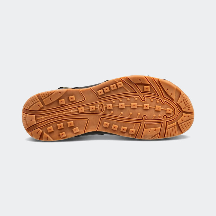 Bottom view of Ula Green Sandals, showcasing the brown rubber sole with a distinctive patterned tread for enhanced grip.