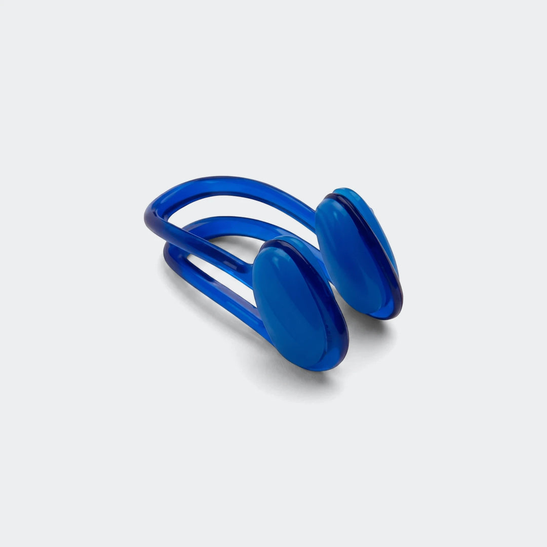 Universal blue nose clip with padded oval grips, plastic swimming nose clamp shown in angled side view.