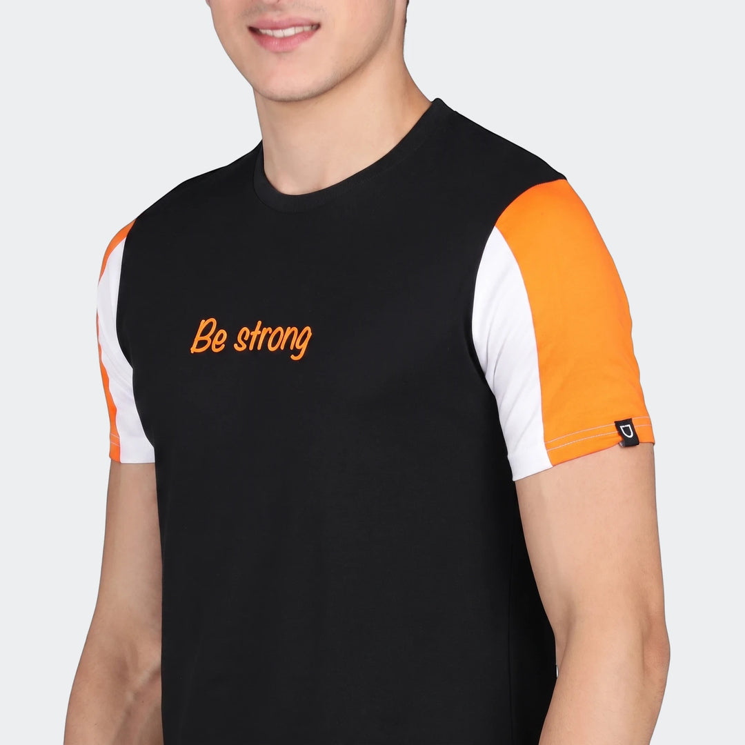 Urbano Set black t-shirt with orange and white color-blocked short sleeves, worn by a male model.
