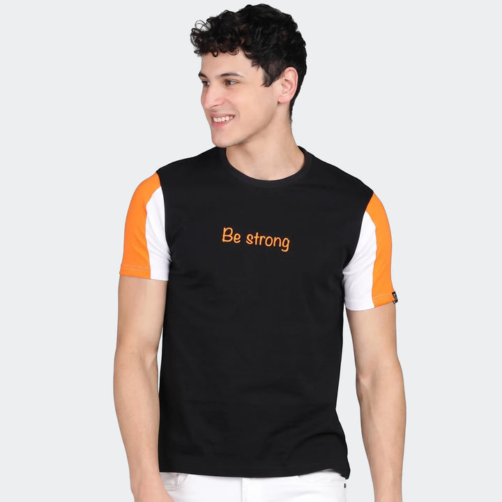 Urbano Set black, orange, and white color-blocked crew neck t-shirt for men, featuring a "Be strong" text print.