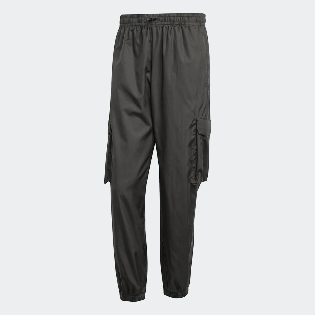 Dark grey utility woven pants featuring cargo pockets, an elasticated drawstring waist, and elasticated cuffs, presented on