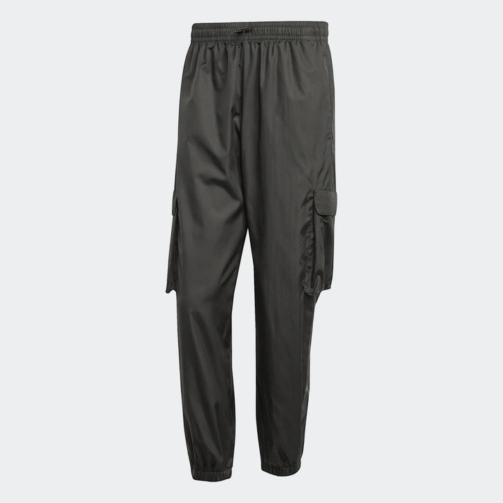 Dark grey utility woven pants featuring cargo pockets, an elasticated drawstring waist, and elasticated cuffs, presented on