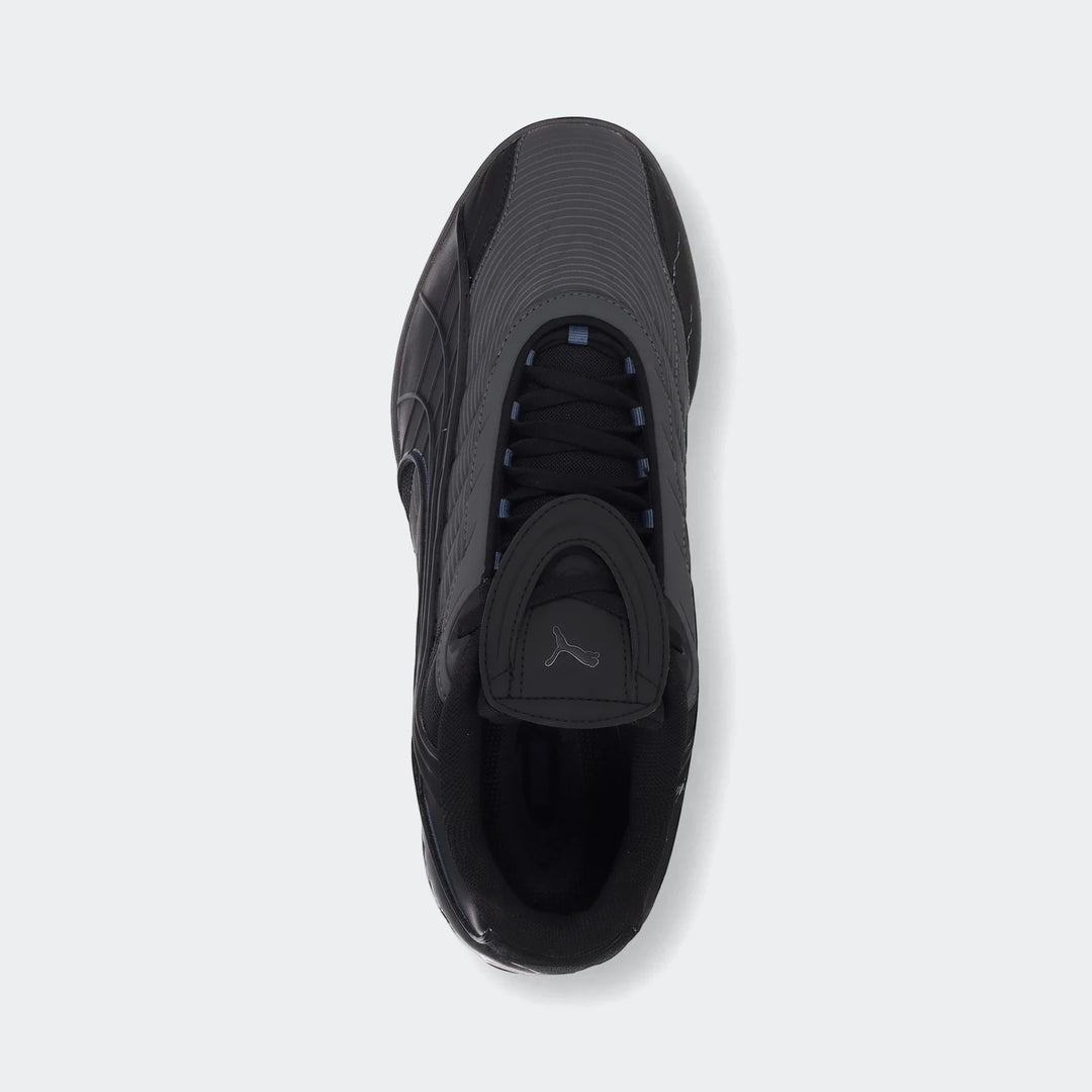 V-S2 Tactical Puma Black sneakers, showcasing a sleek black design and textured upper, captured in a top-down view.