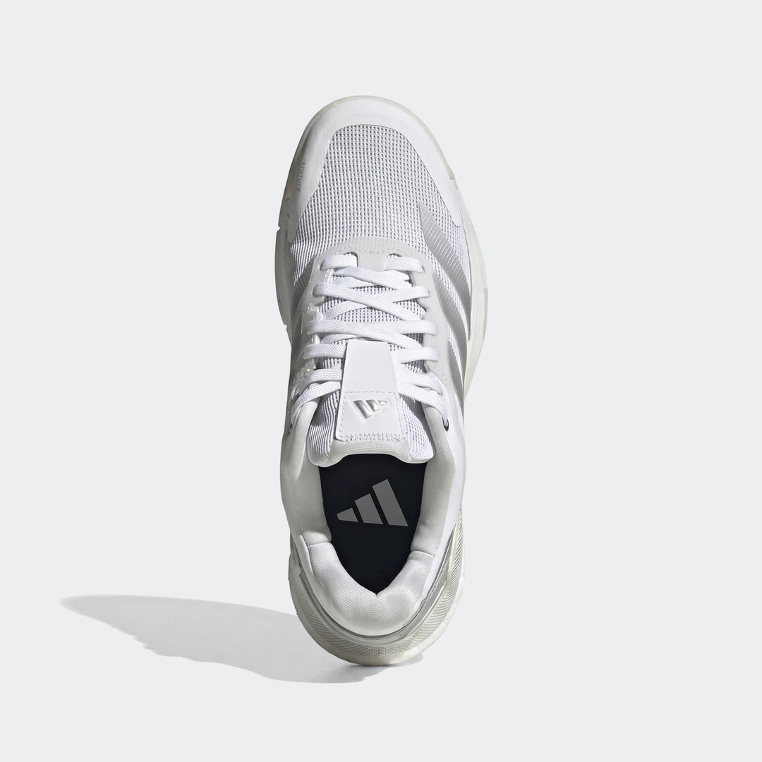 White Adidas Crazyquick Boost Padel shoes with a mesh upper, shown from a top-down view on a neutral background.