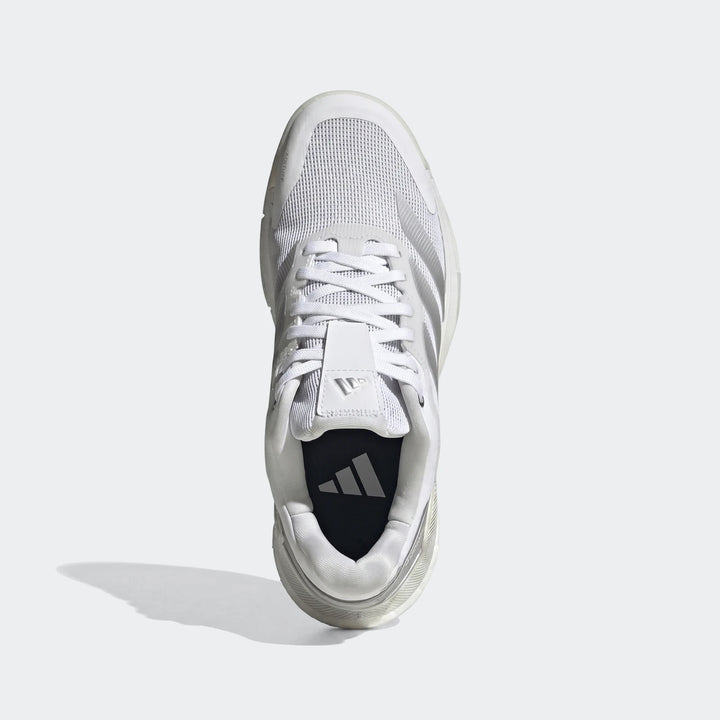 White Adidas Crazyquick Boost Padel shoes with a mesh upper, shown from a top-down view on a neutral background.