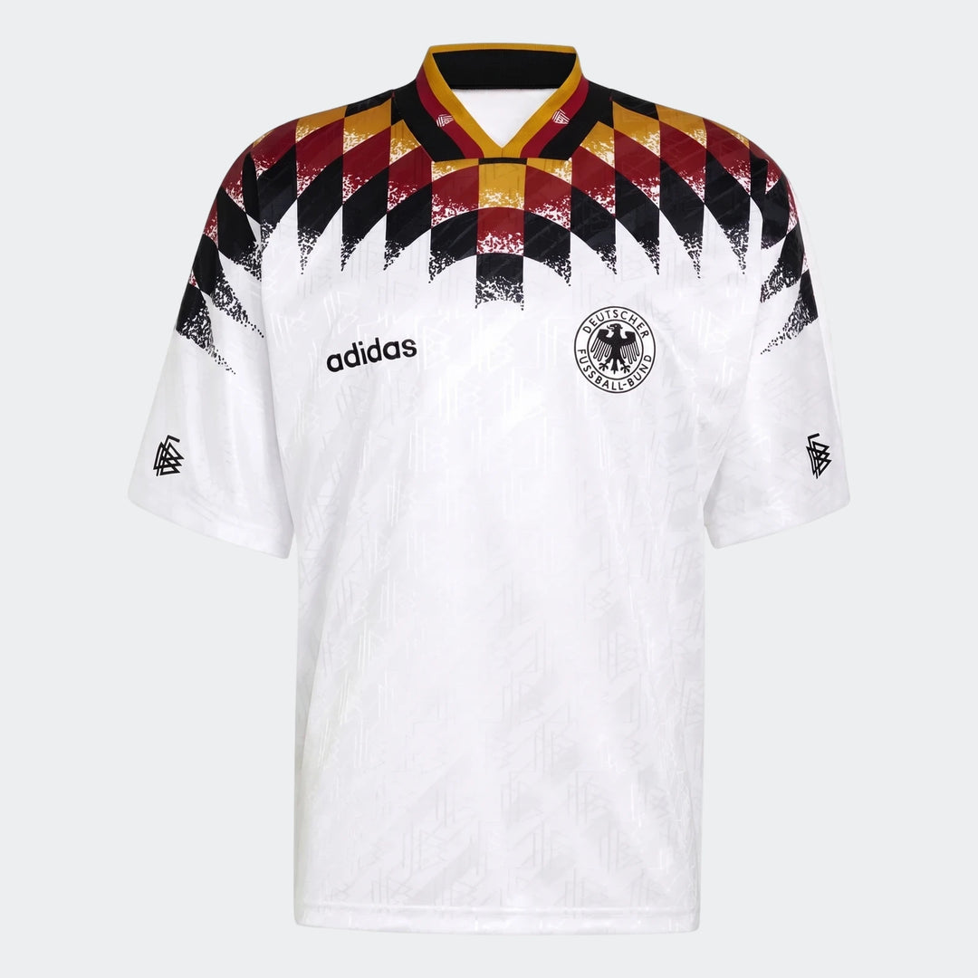 White Adidas Germany football jersey with black, red, and yellow diamond pattern on shoulders and collar, front view.