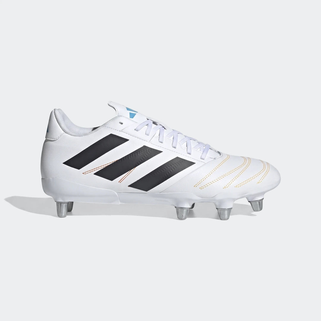 White Adidas Kakari Elite SG rugby boots with black three stripes, white laces, and metal studs, shown in a side view.