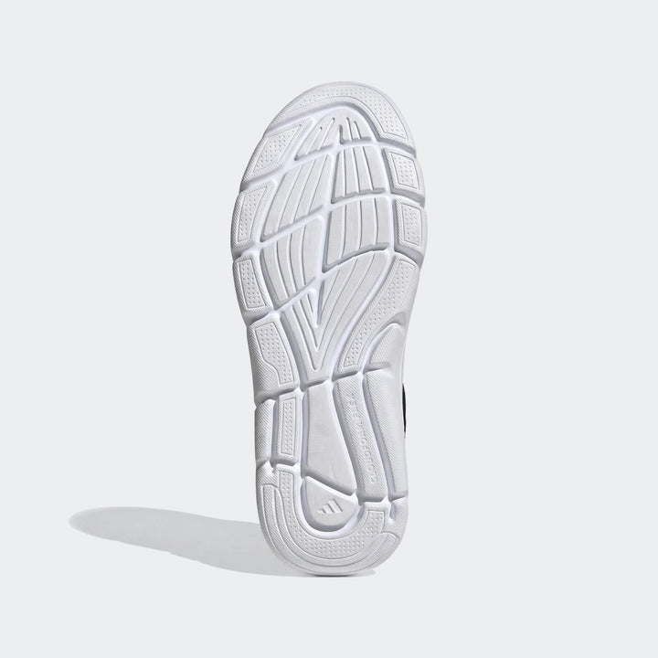 Close-up view of a white athletic shoe sole, showcasing the detailed tread pattern and Cloudfoam Flex branding.