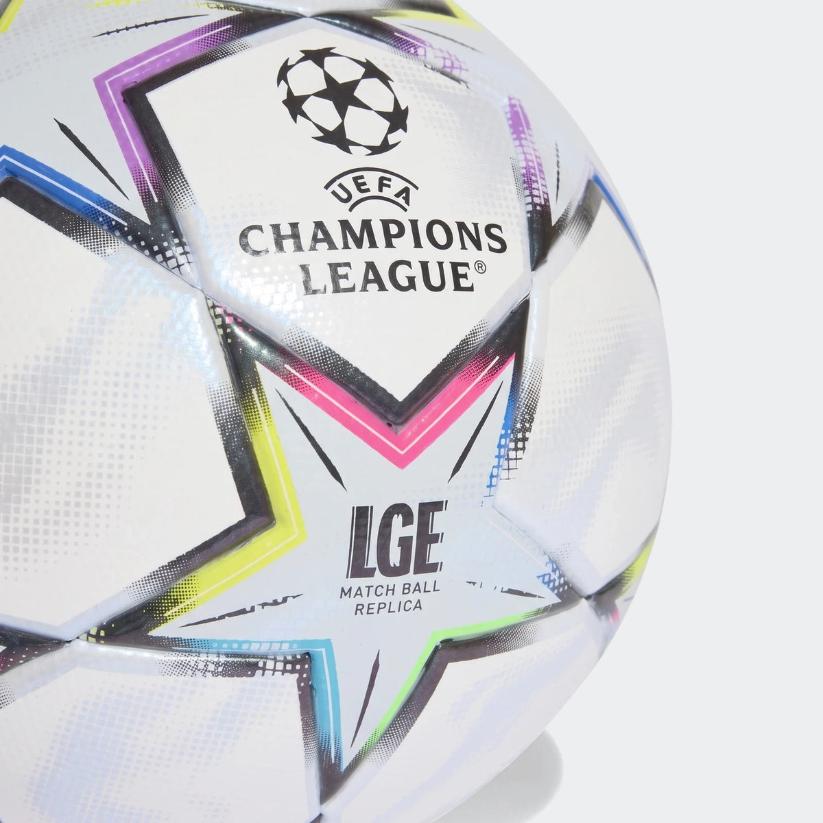 Close-up of a white UEFA Champions League 26/27 League Ball featuring colorful graphic details and brand logos.