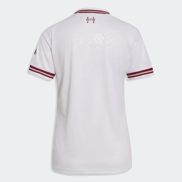 White women's Liverpool FC 26/27 away jersey, featuring maroon collar and sleeve trim, shown from the back.