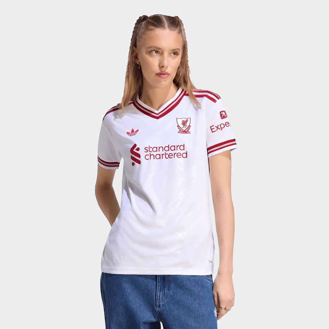 Womens Liverpool Fc 26/27 Away Jersey in white with red details, modeled by a woman from the waist up in a studio.