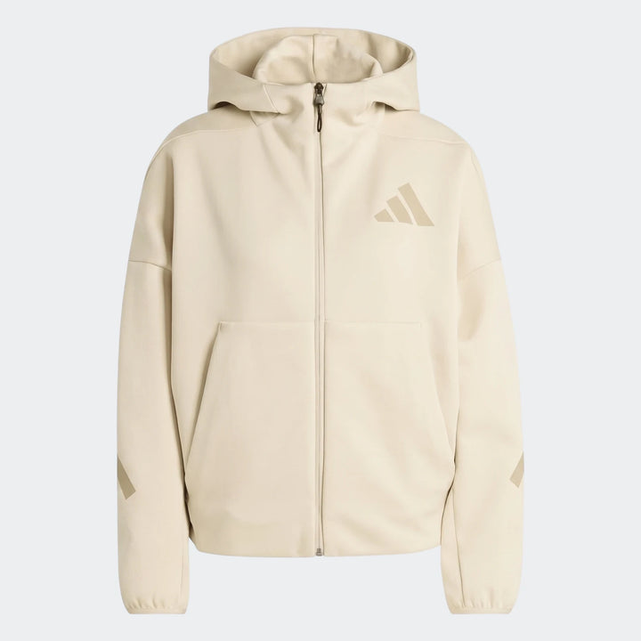 Women's Z.N.E. Full-Zip Jacket in beige, featuring a hood, front zipper, and Adidas logo, presented in a flat-lay style.