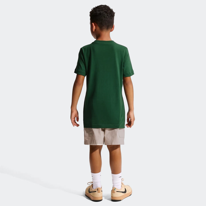 Young boy from behind wearing a dark green 2026 Nike Springboks Rugby's Greatest Rivalry Tour Kids T-Shirt with beige shorts