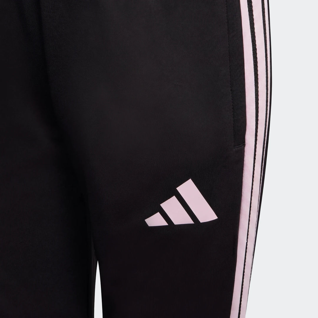Close-up of Youth Adidas Tiro 26 Competition Training Pants in black with pink three-stripe detail and logo. Athleticwear.