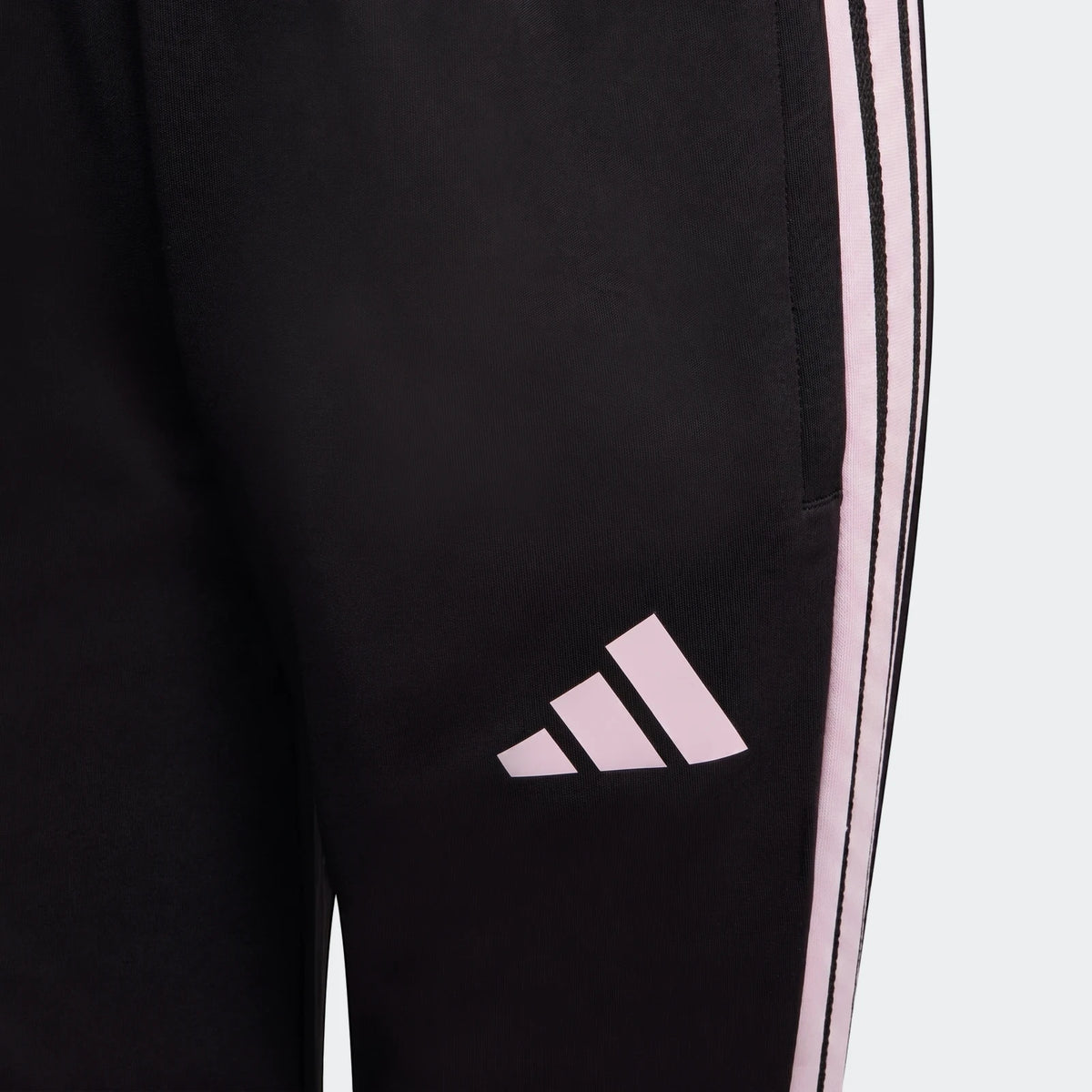 Close-up of Youth Adidas Tiro 26 Competition Training Pants in black with pink three-stripe detail and logo. Athleticwear.