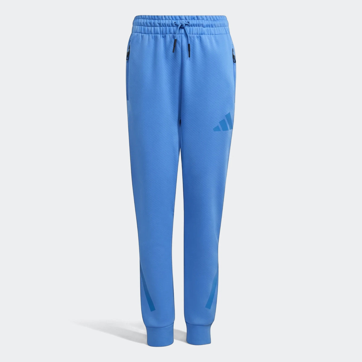 Blue Youth Z.N.E. Track Pants with a subtle honeycomb texture and iconic Adidas branding, shown front view.