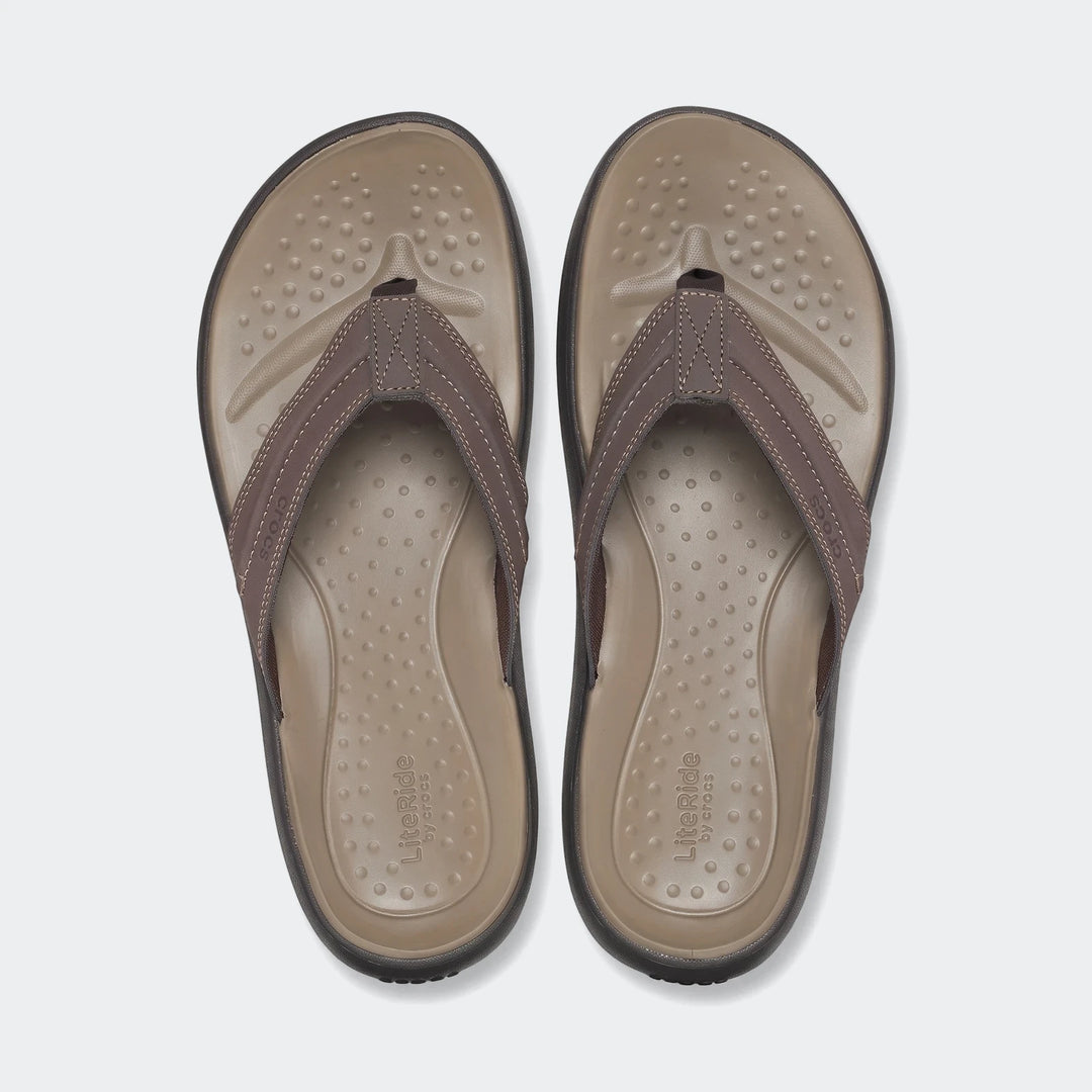 Pair of men's brown LiteRide flip-flops, shown from a top-down view, featuring textured footbeds and durable straps, ideal