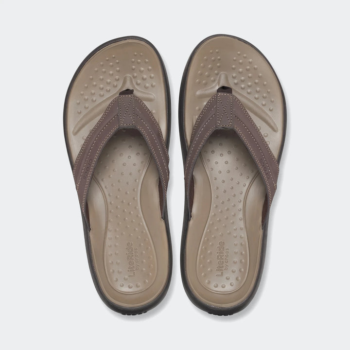 Pair of men's brown LiteRide flip-flops, shown from a top-down view, featuring textured footbeds and durable straps, ideal