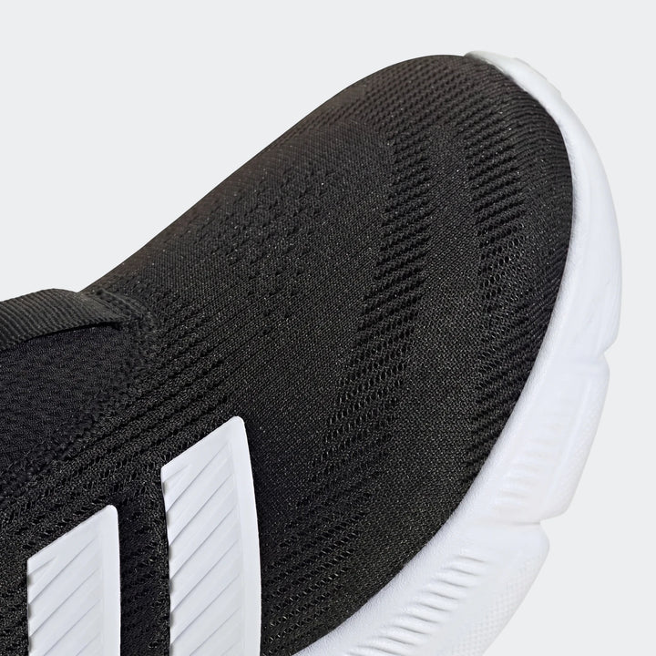 Close-up of a Z.N.E. Track Top, showcasing its black knit fabric construction with a distinctive textured pattern, accented
