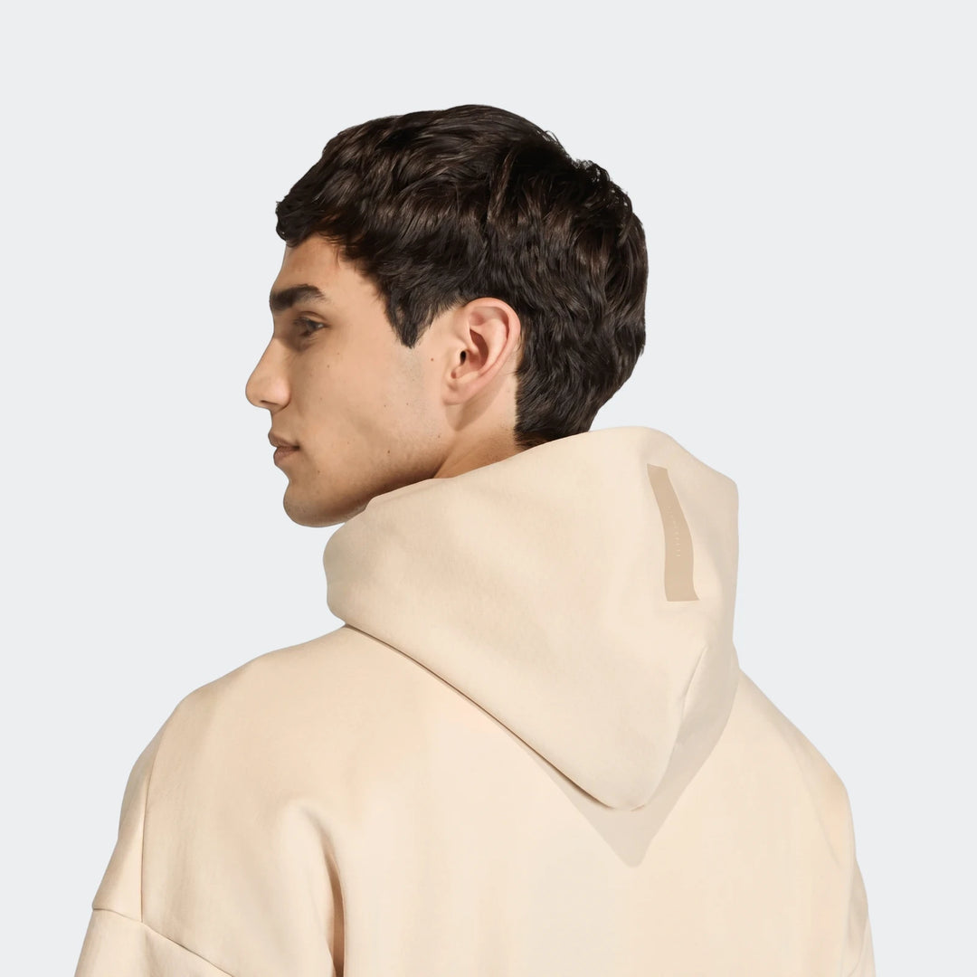 Light beige Z.N.E. Full-Zip Hoodie worn by a male model, showcasing the back view and hood detail.